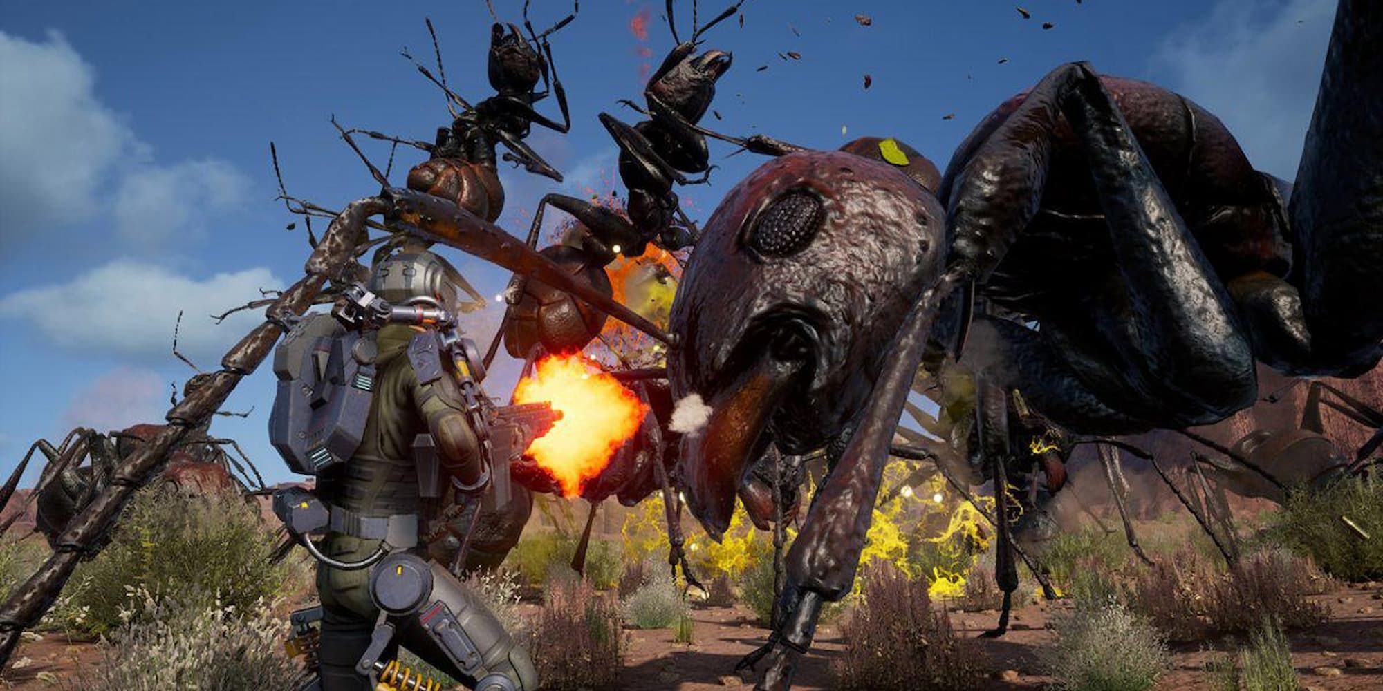 The player character fires upon a group of large invading ants in Earth Defense Force: Iron Rain.
