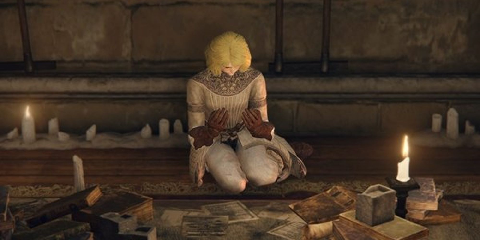 Elden Ring Roderika sitting on the ground in front of scattered papers and candles