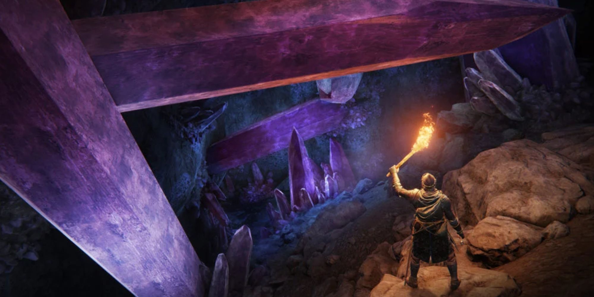Tarnished holding a torch, illuminating giant pink crystals in the Sellia Hideaway in Elden Ring