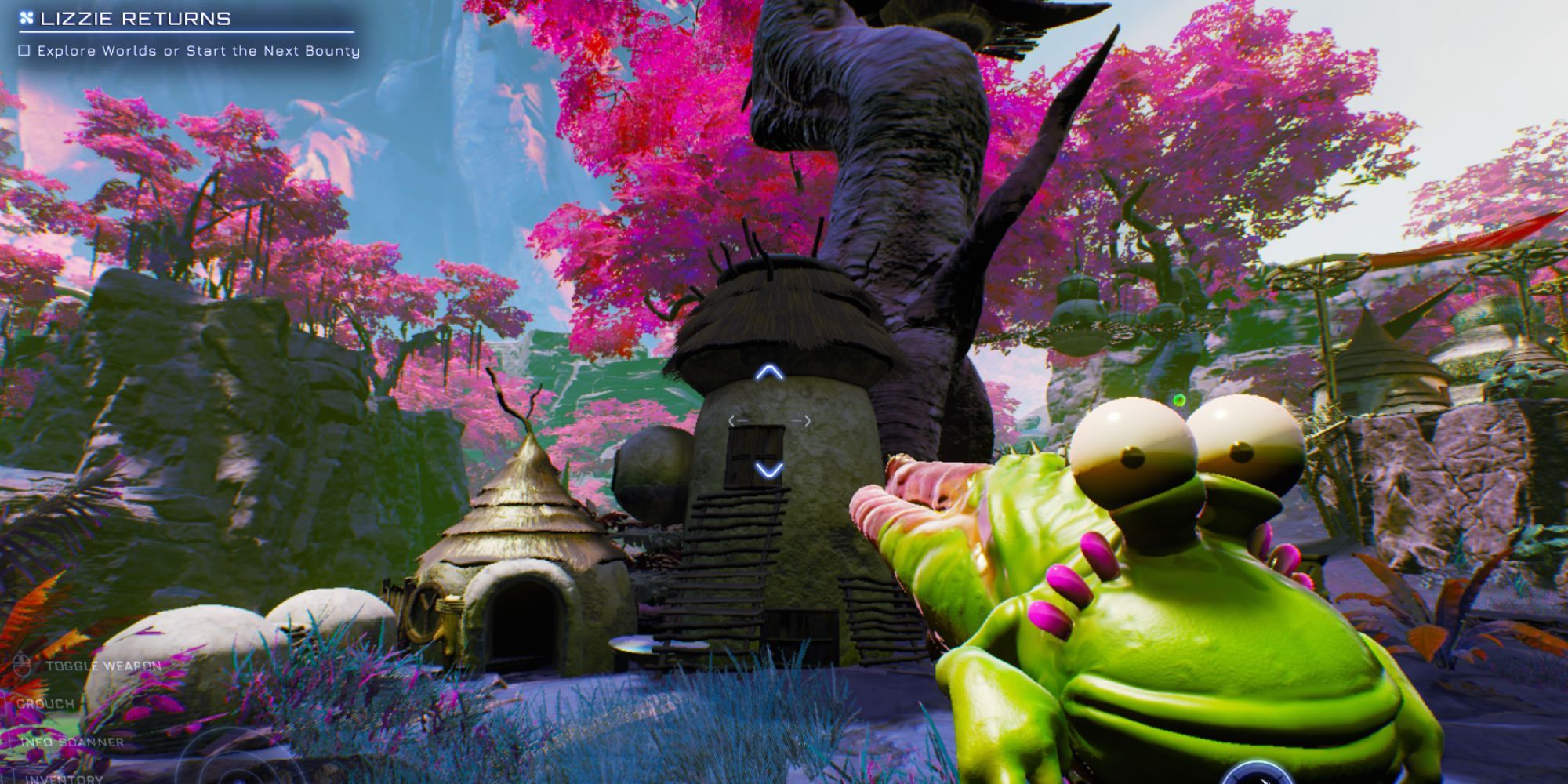 Gus aimed at a house in Zephyr. There are beautiful bright pink trees in the background and a blue sky.