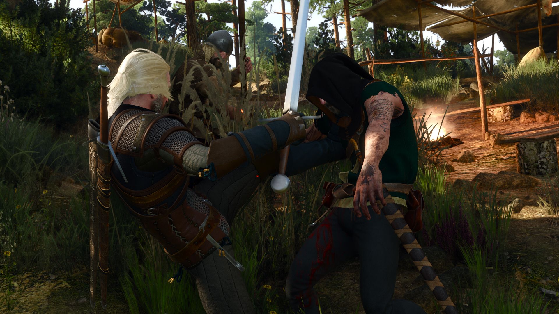 Geralt kicks a foe away in the middle of a melee at a bandit camp.