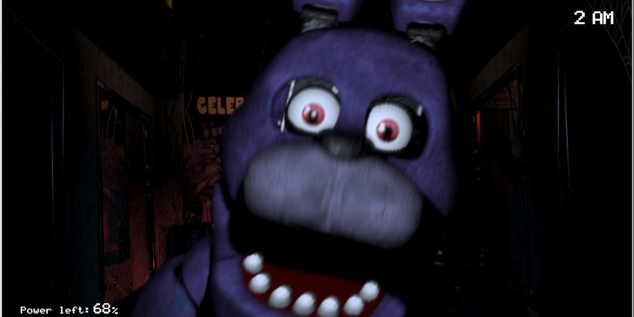 Bonnie jumps out at the security camera in Five Nights at Freddy's