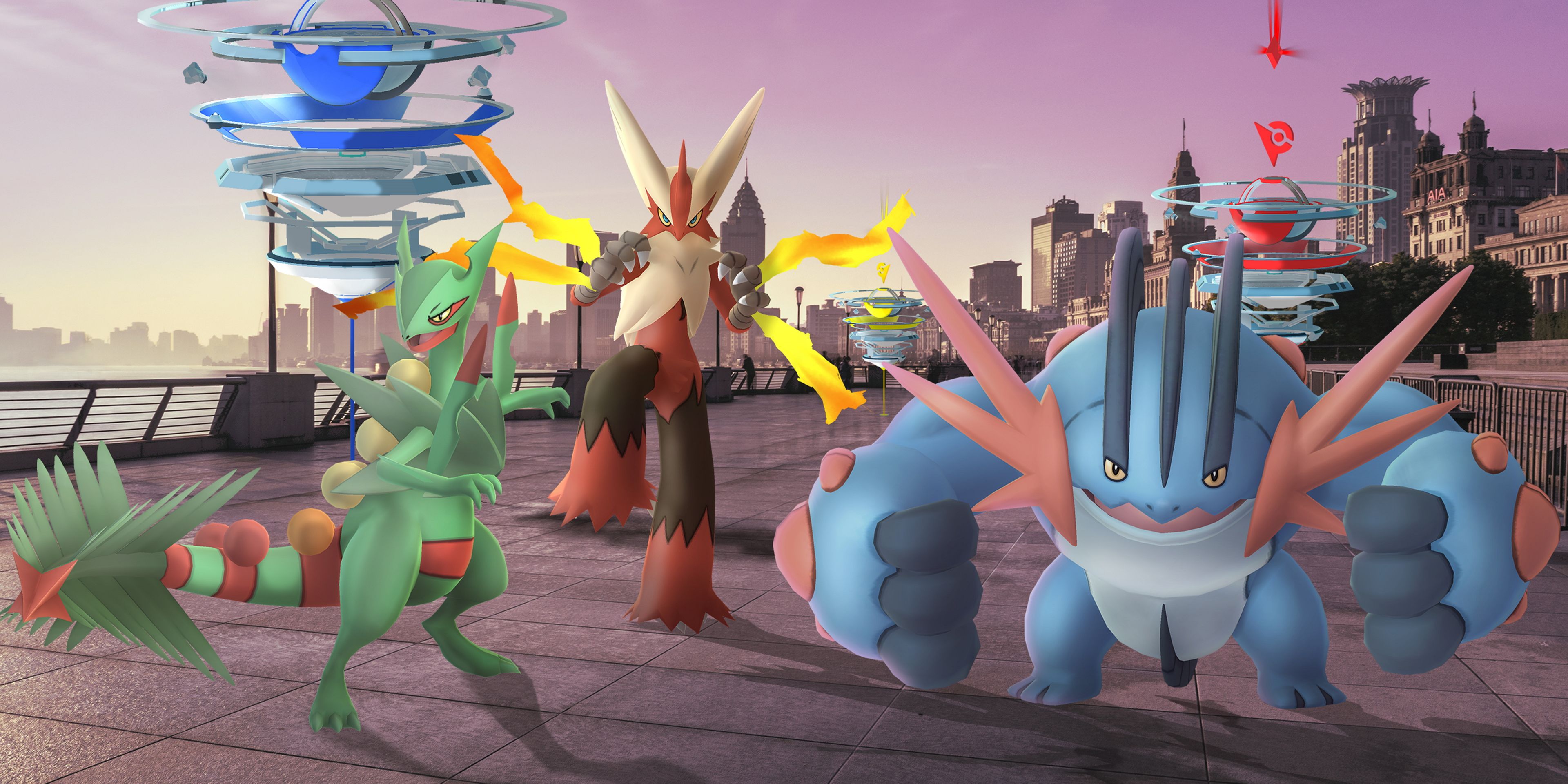 Mega Sceptile, Mega Blaziken, and Mega Swampert standing in front of two Pokemon Gyms