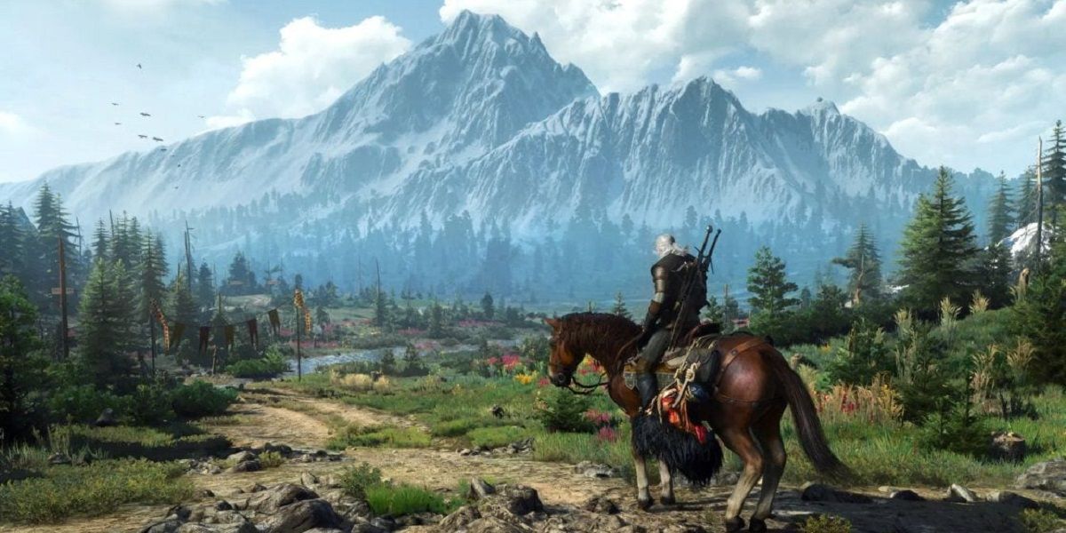 Geralt and Roach walking along a path by the Ray Tracing mountain