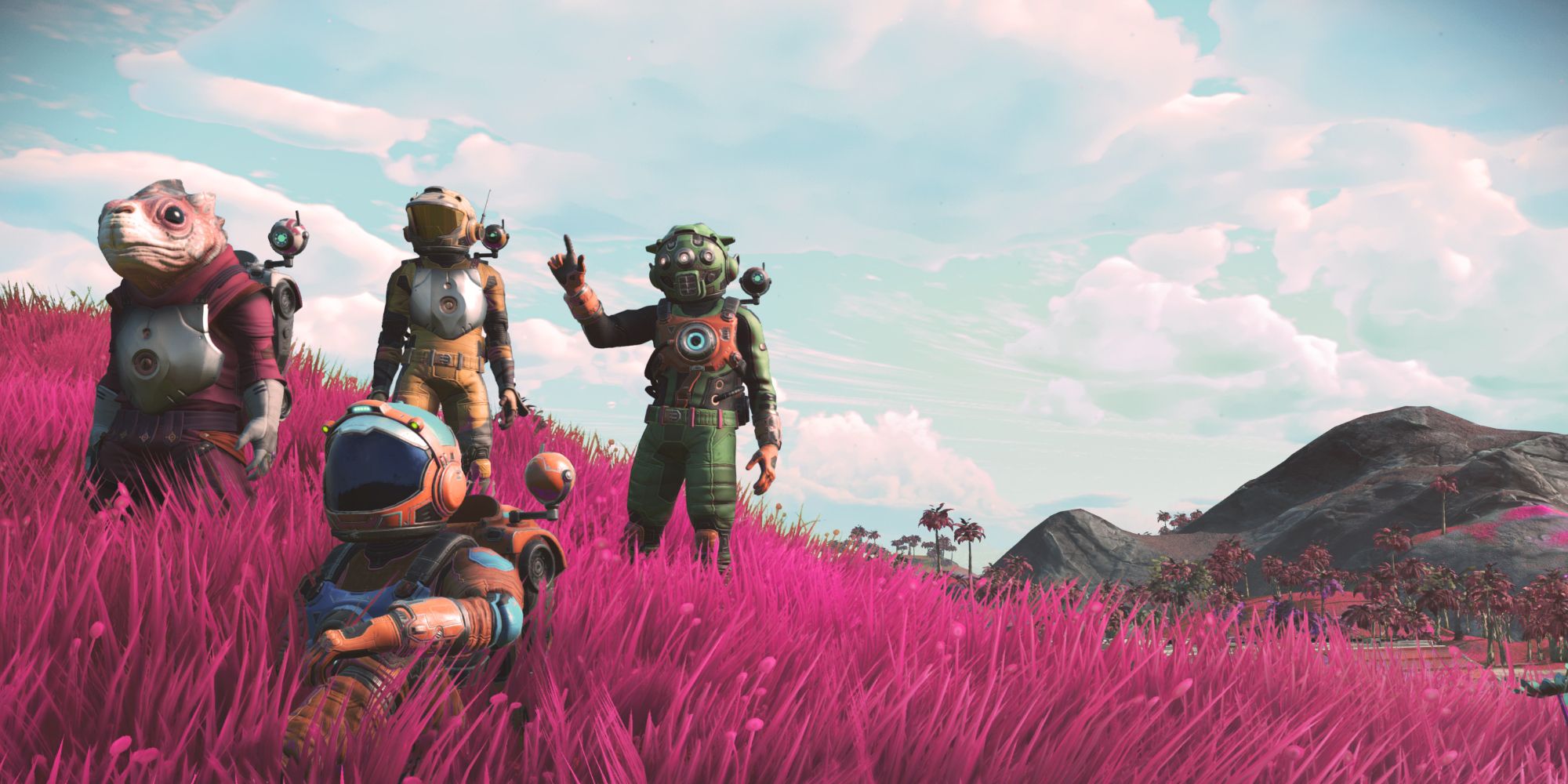 Three players in masks and another as an alien standing in red grass in No Man's Sky