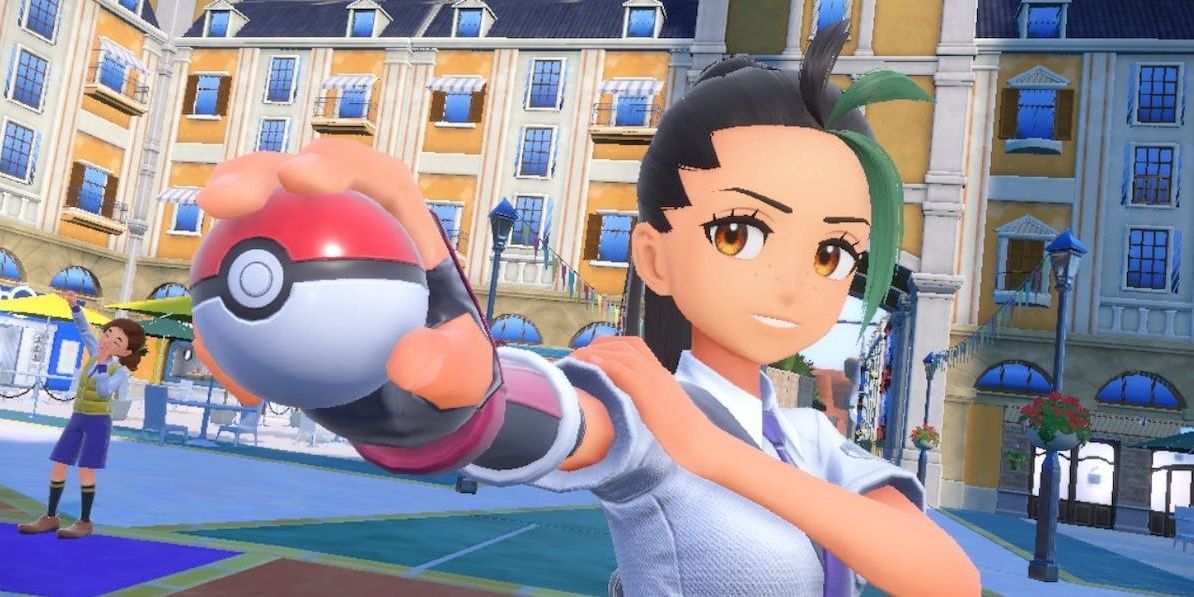 Nemona holding a Pokeball in the middle of town
