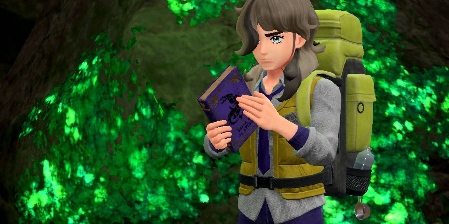 Arven holding a book about Herba Mystica in Pokemon Scarlet & Violet.