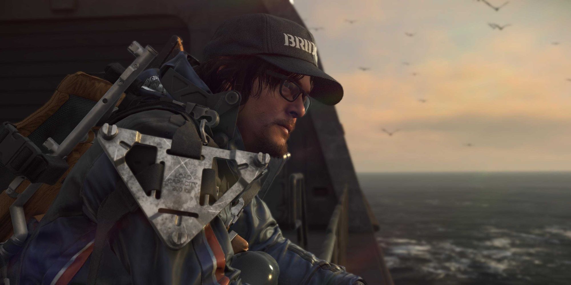 Sam looking out at the ocean in Death Stranding.