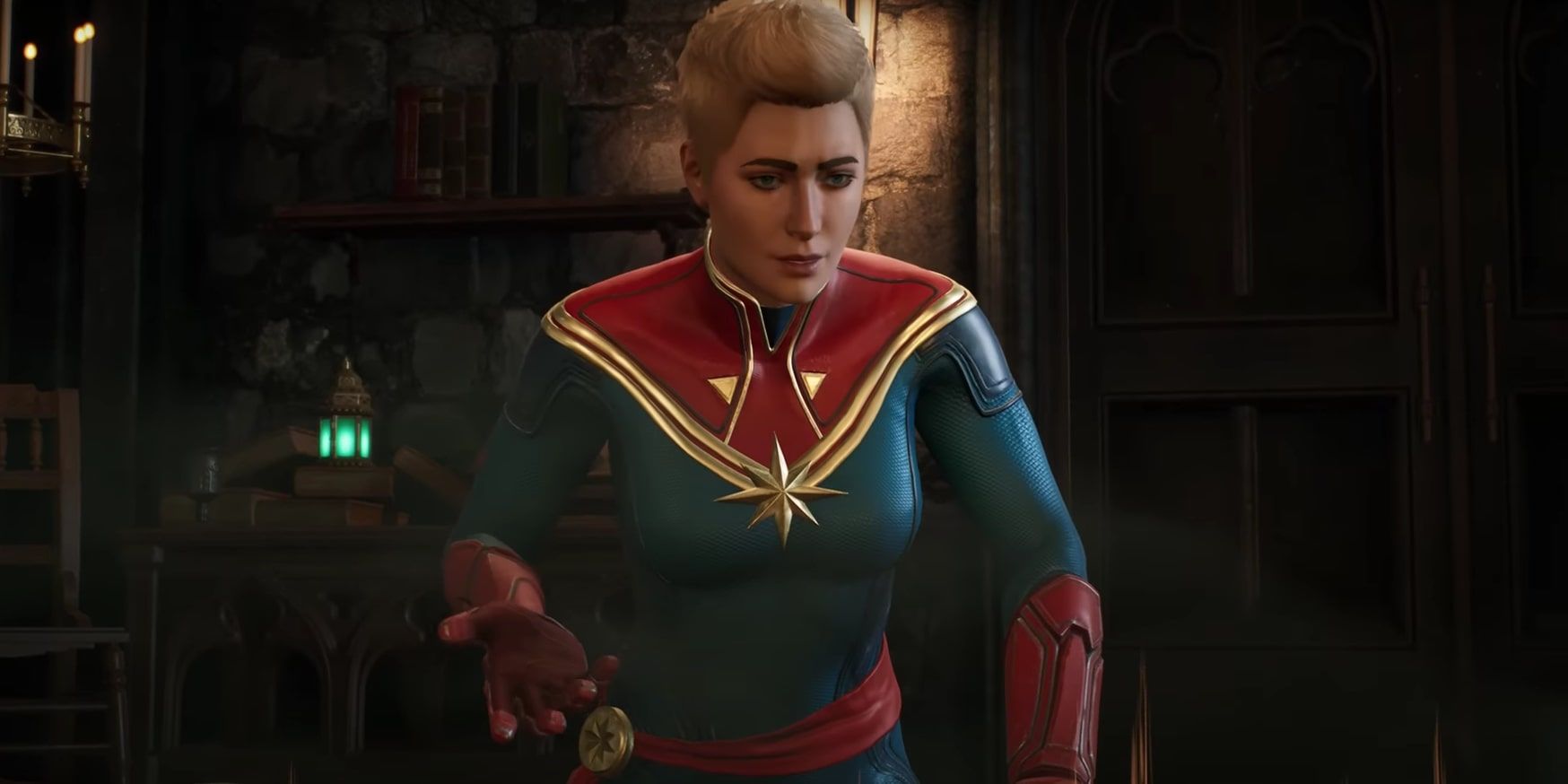 Captain Marvel is looking at the Caretaker's virtual map table in The Abbey.