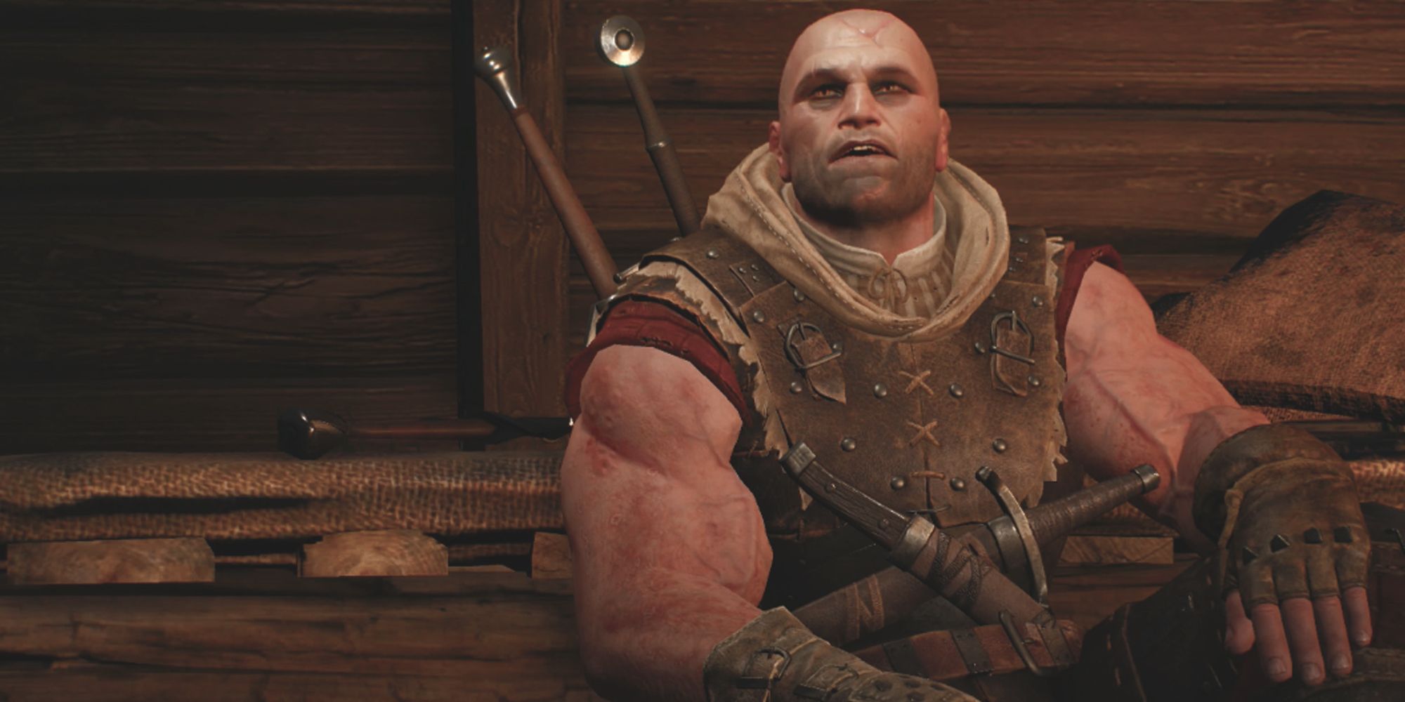 The Witcher Letho sitting down in a wooden cabin