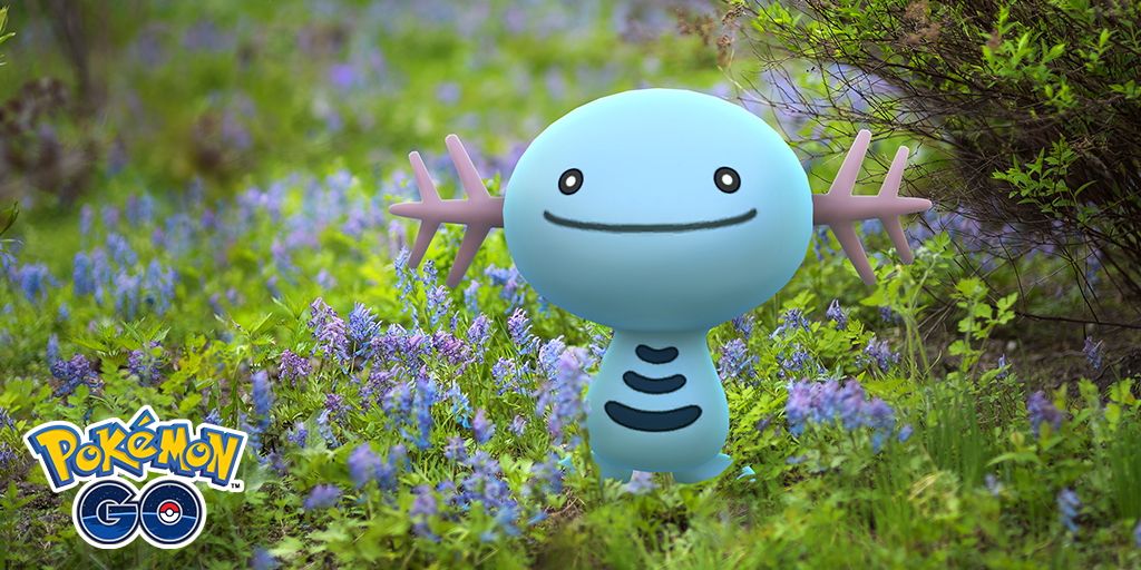 Wooper from Pokemon standing in a flowery field, with the Pokemon Go logo in the bottom-left