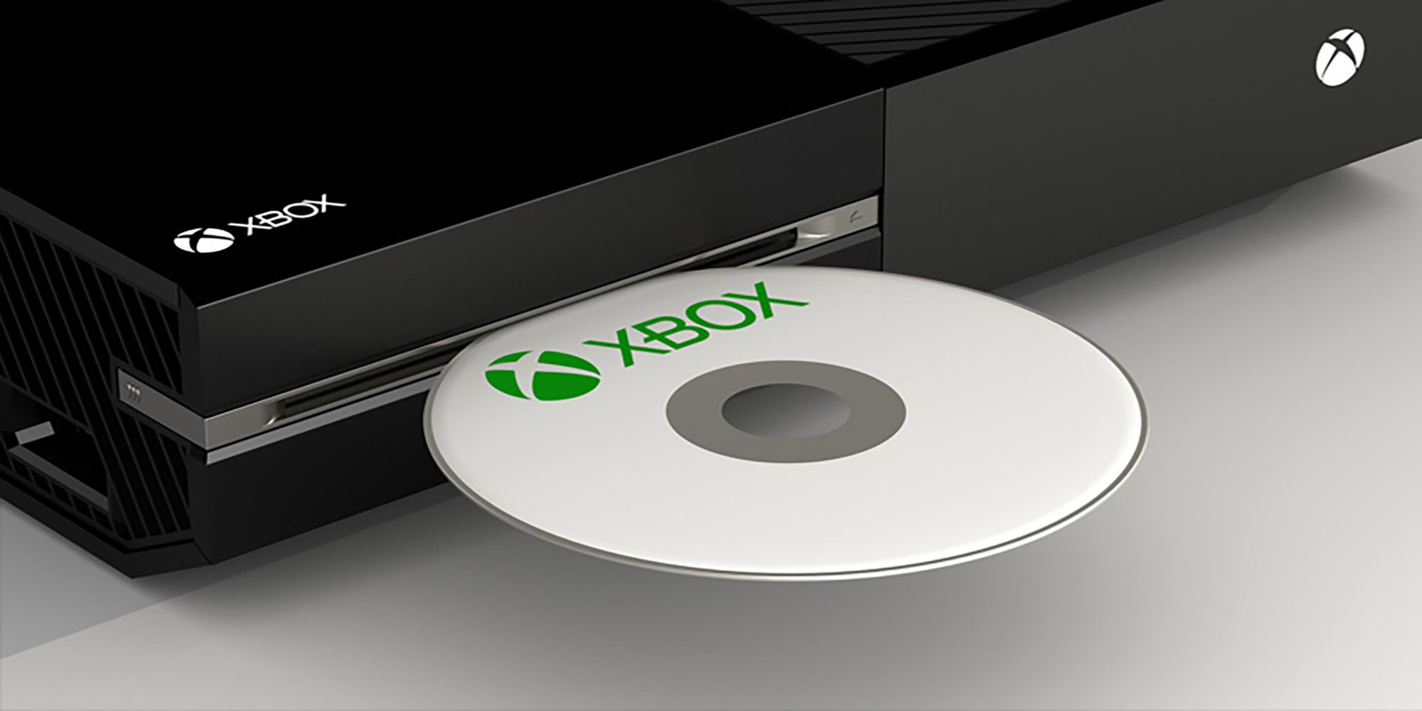 A game disk sticking out of an Xbox ONE disk drive.