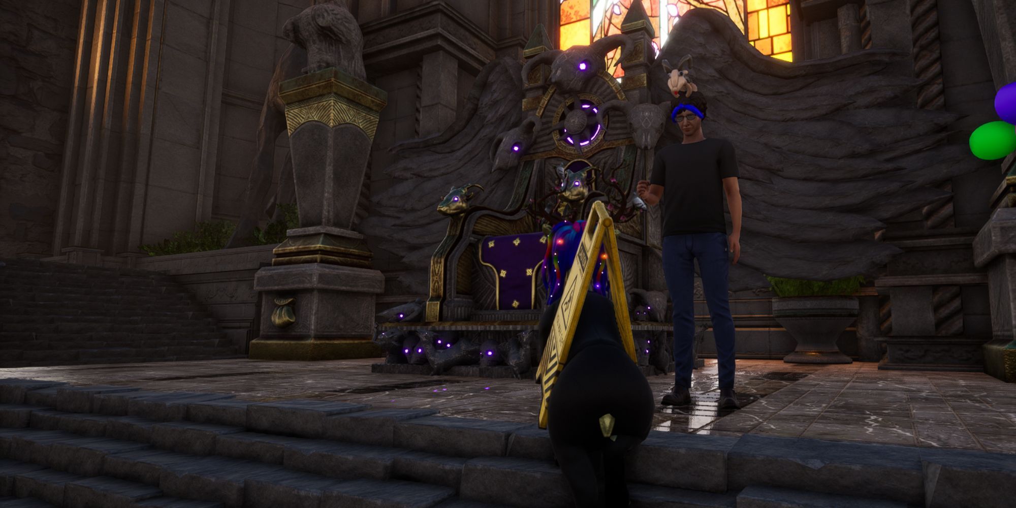 Pilgor faces Philip's character as he stands in front of the throne wearing a balloon animal hat
