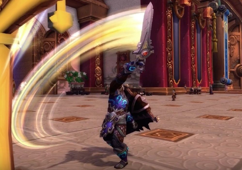 World of Warcraft: A Warrior attacks with an upper cut, using a sword.