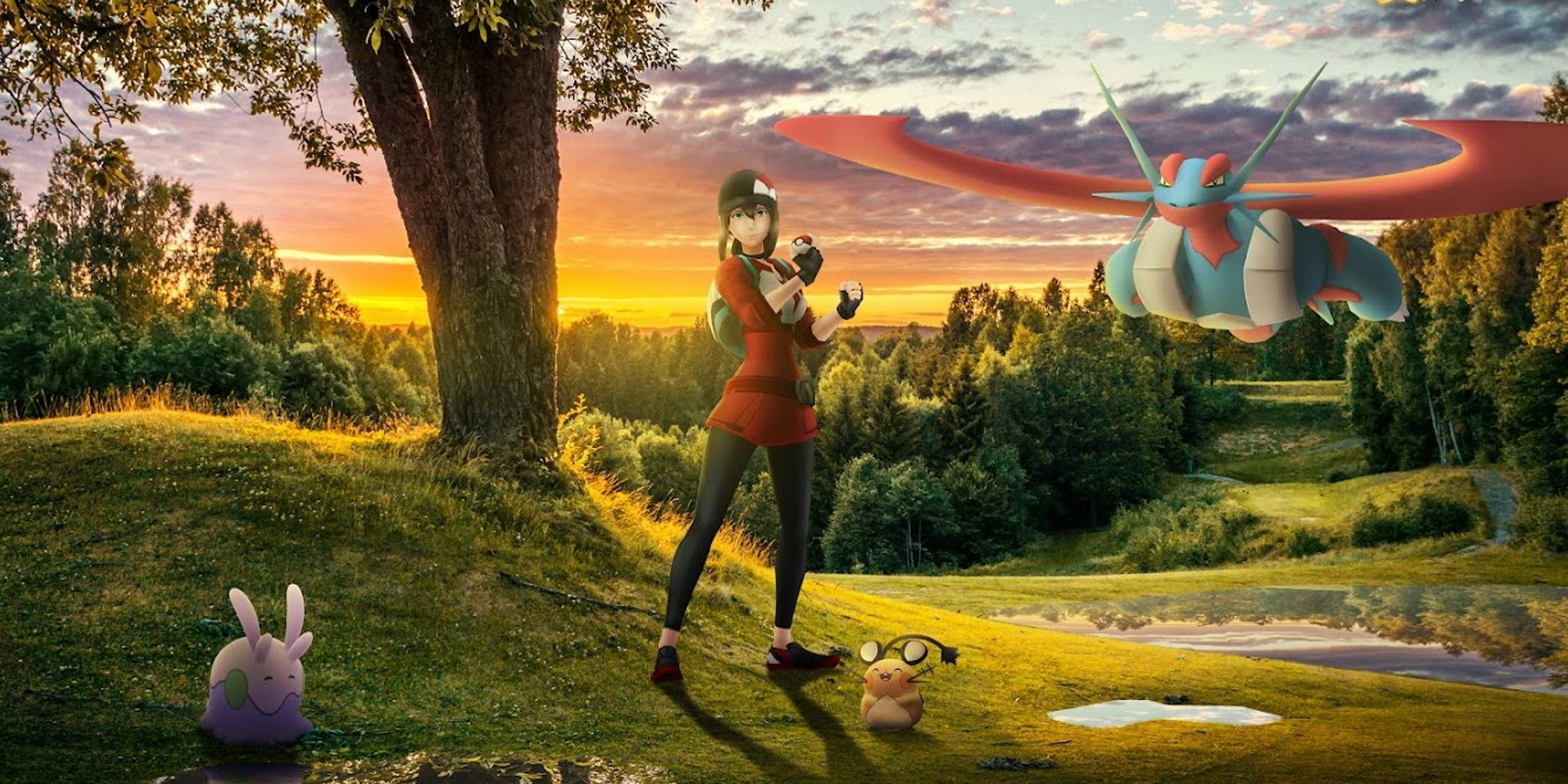 A Pokemon Go trainer standing in a grassy field with Goomy, Dedenne, and Mega Salamence