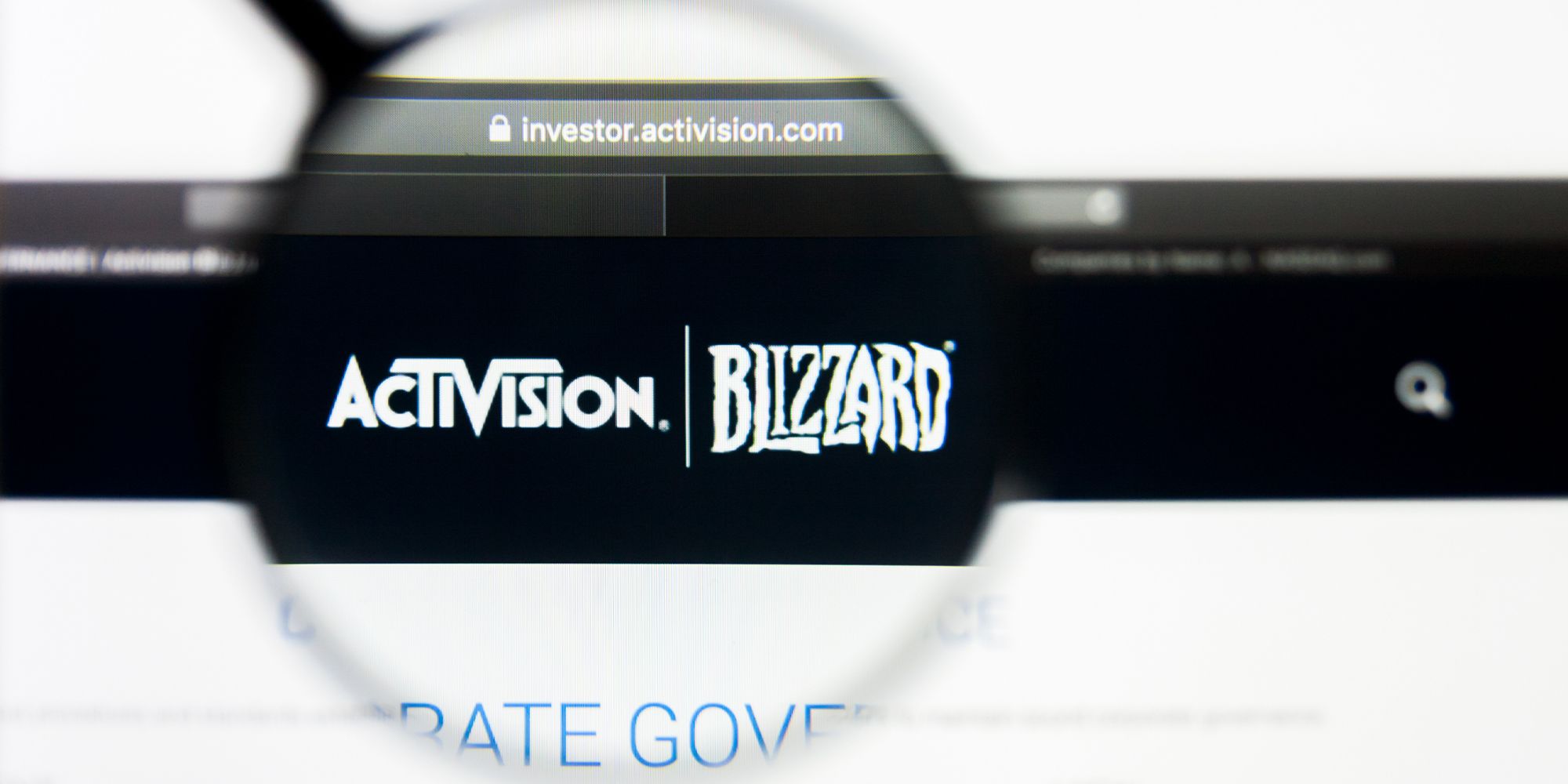 Magnifying glass placed over a website, highlighting the Activision Blizzard logo