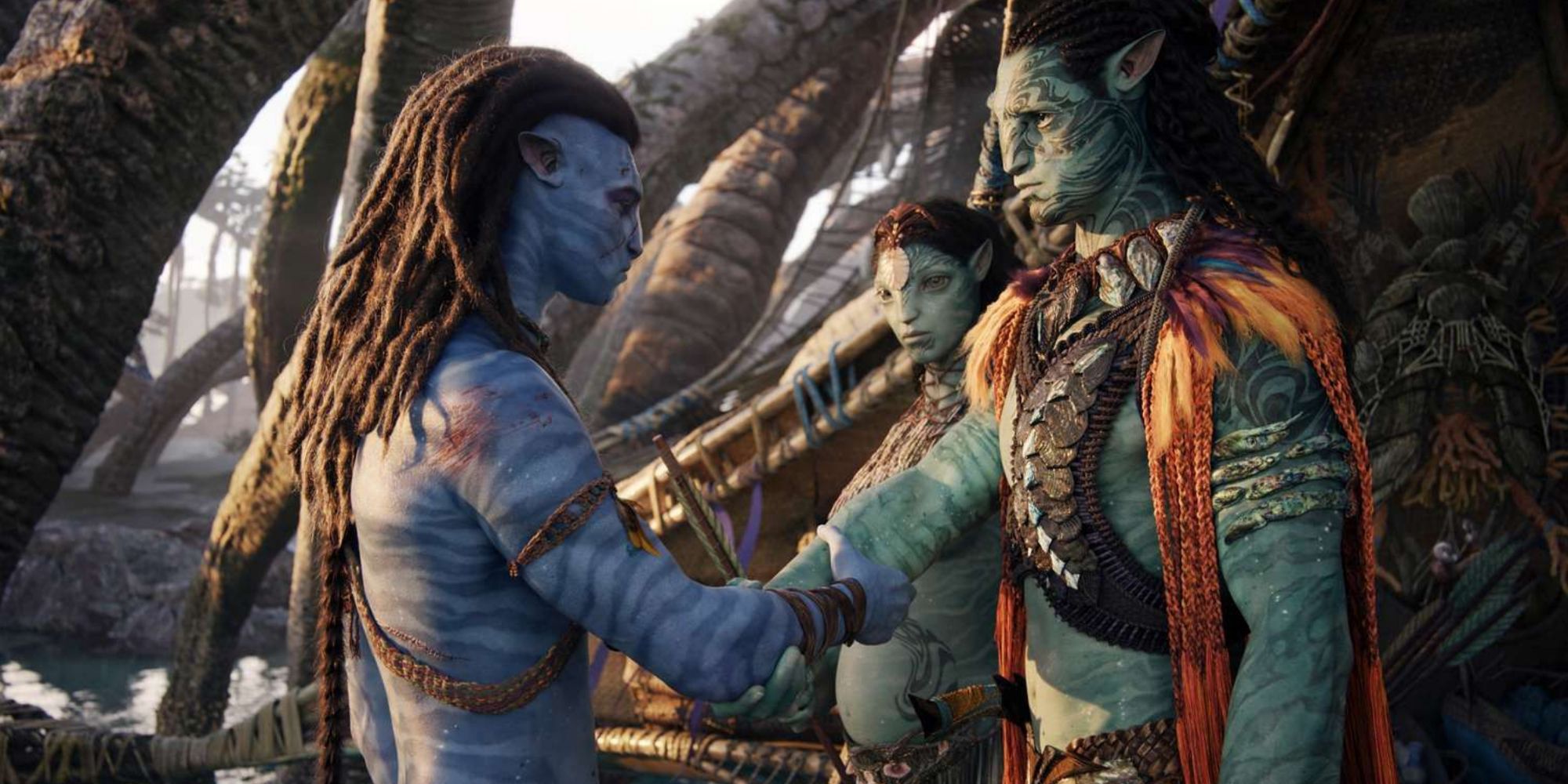 Avatar: The Way of Water screenshot of Jake and Tonowari shaking hands as Ronal watches