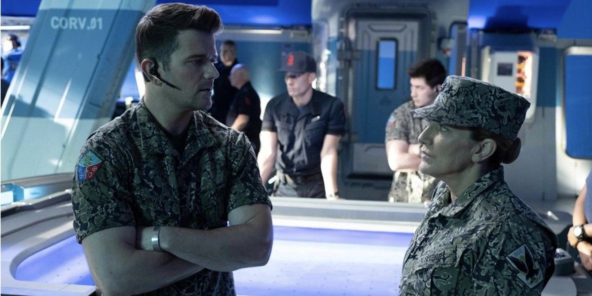Avatar: The Way of Water screenshot of an RDA officer (left) speaking to General Frances Ardmore (right)
