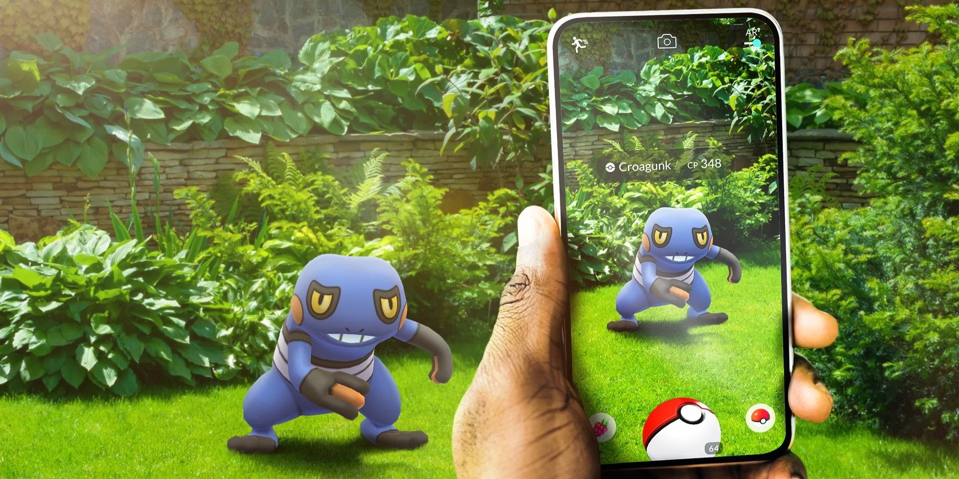 A hand holding a phone while playing Pokemon Go, pointing at a Croagunk standing in grass