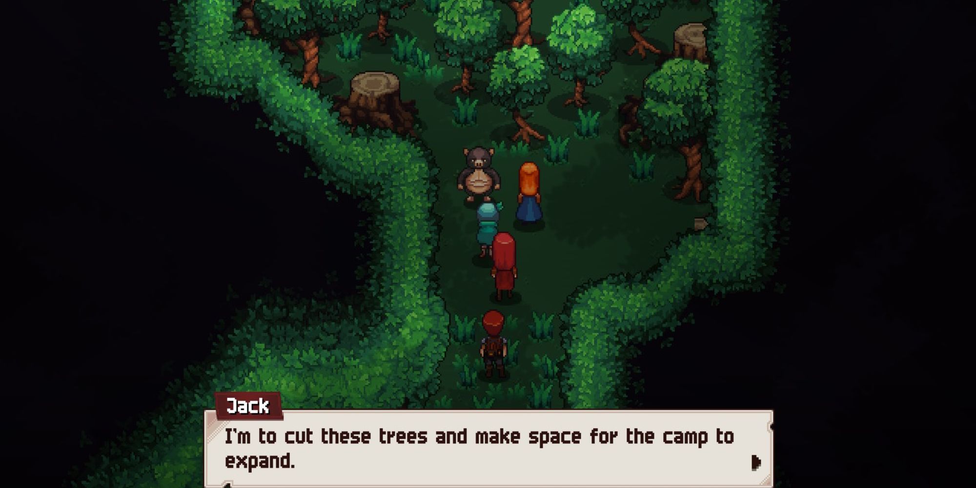 Jack stands in front of some trees in the research camp area of the Fiorwoods
