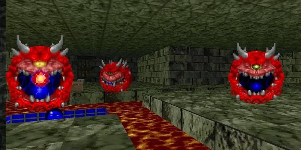 Three Cacodemons, floating heads, attacking in Doom the video game