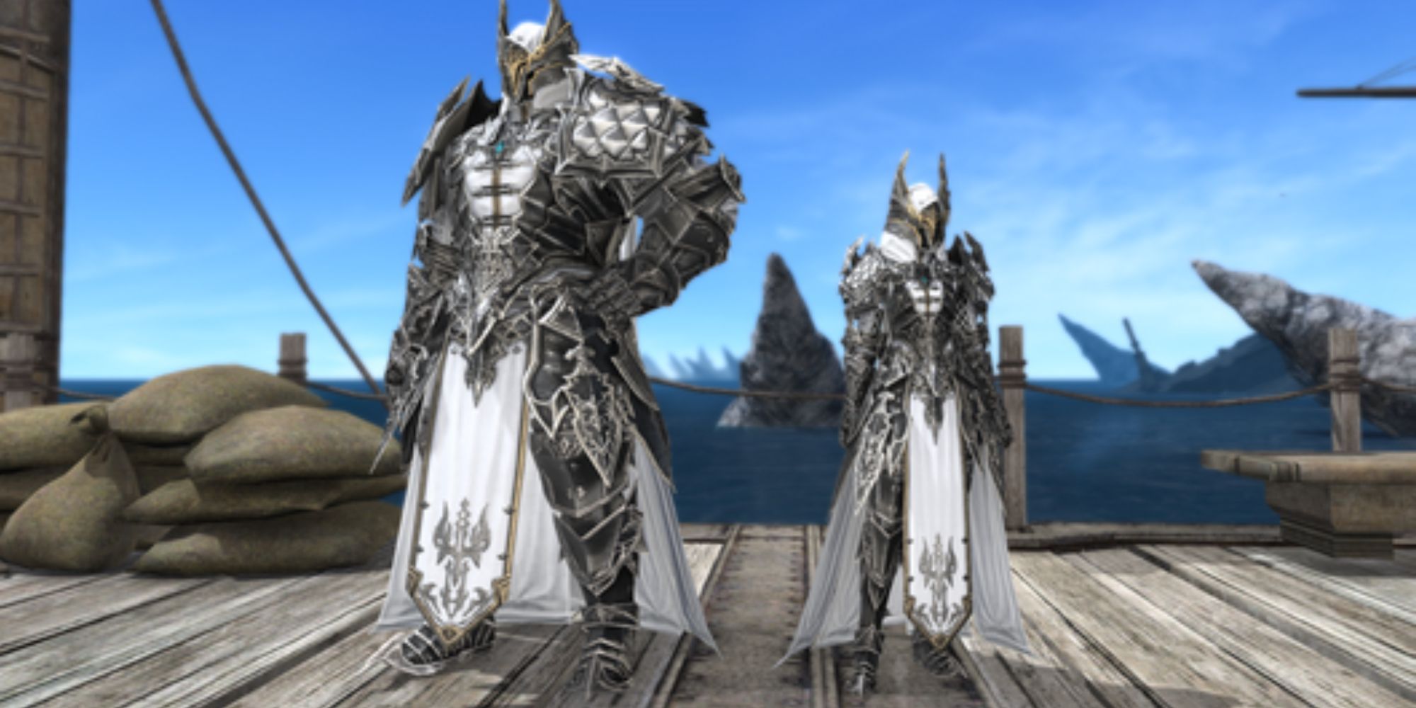 The Monarchy Attire seems to be inspired by a Griffin, with a stylized black winged helmet with gold trim, a flowing white cape, a black and white color scheme, and a blue jewel in the middle of the chest. The left model showcases the gear on larger characters, with the one on the left showing how it looks on smaller characters. The False Monarchy Attire is obtained in PvP Series 3 of Final Fantasy 14.