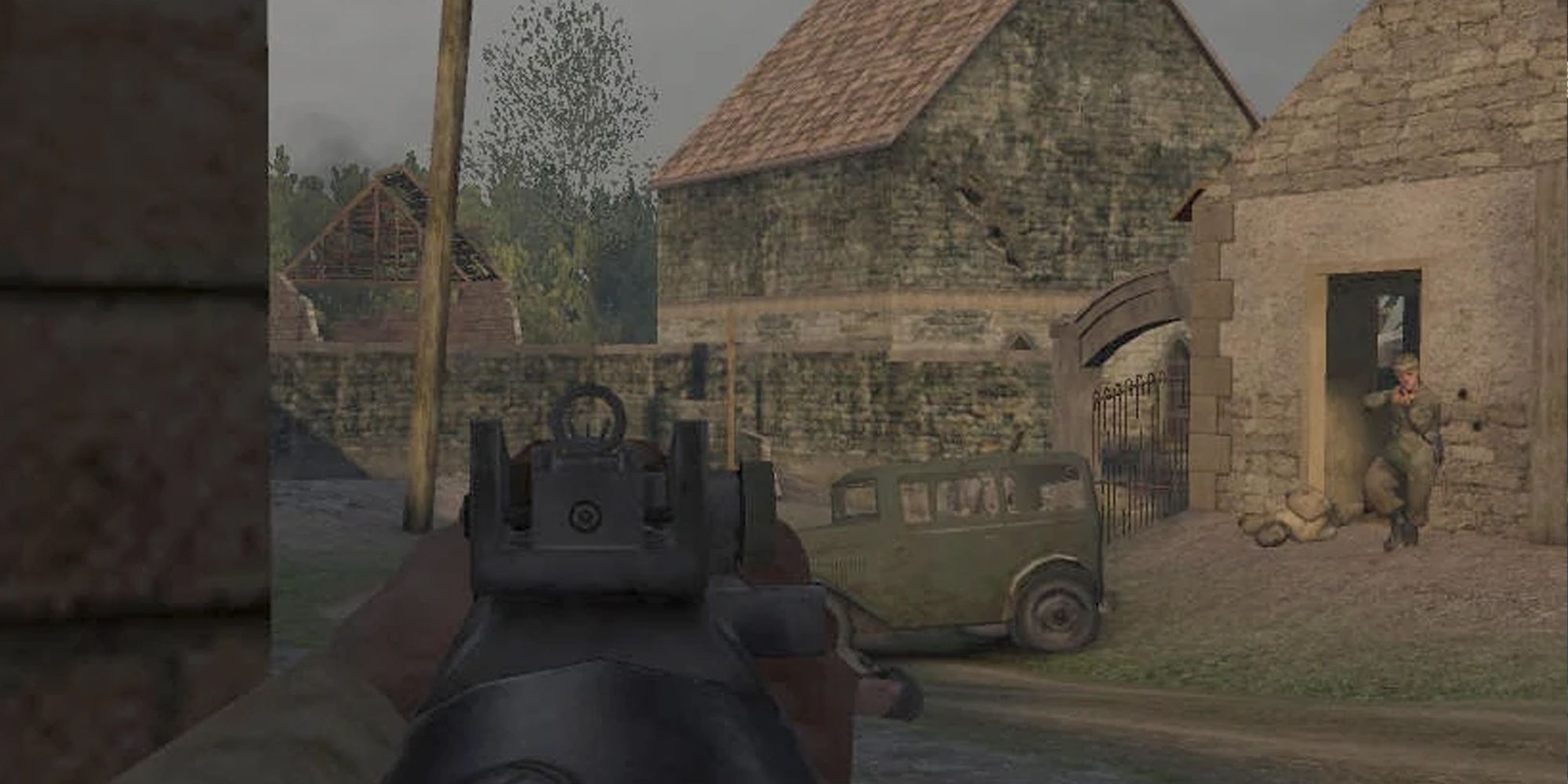 Call of Duty soldier pointing a gun at a wall in first-person as a soldier comes out a house to the right with their gun raised