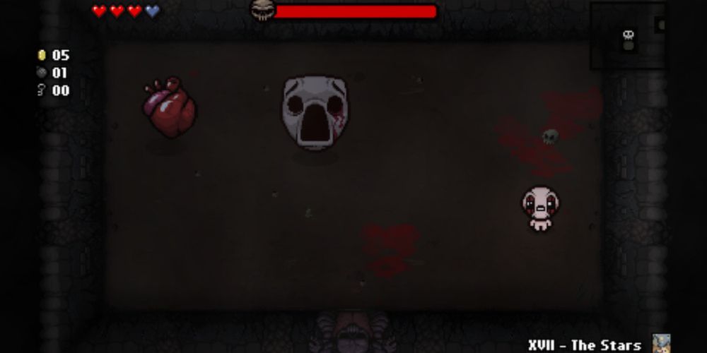Isaac fighting a boss in an arena