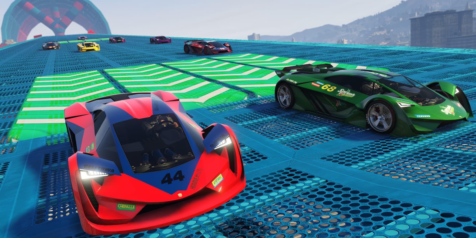 Several cars race up a blue ramp and pass a green speed boost pad in Grand Theft Auto 5.
