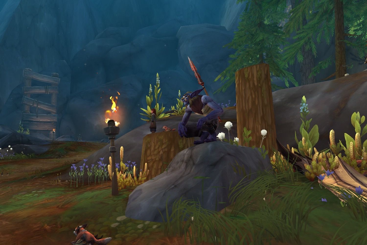 The troll questgiver, Zon’Wogi, sitting on a rock in Three-Falls Lookout.