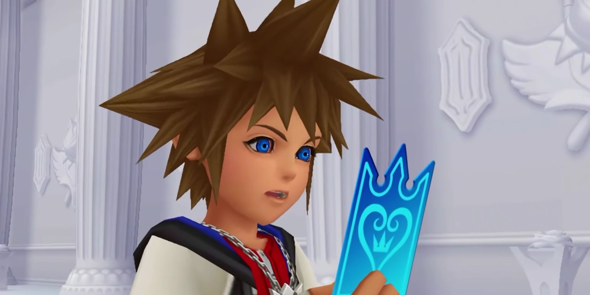 Sora looking at a card in Re Chain of Memories.
