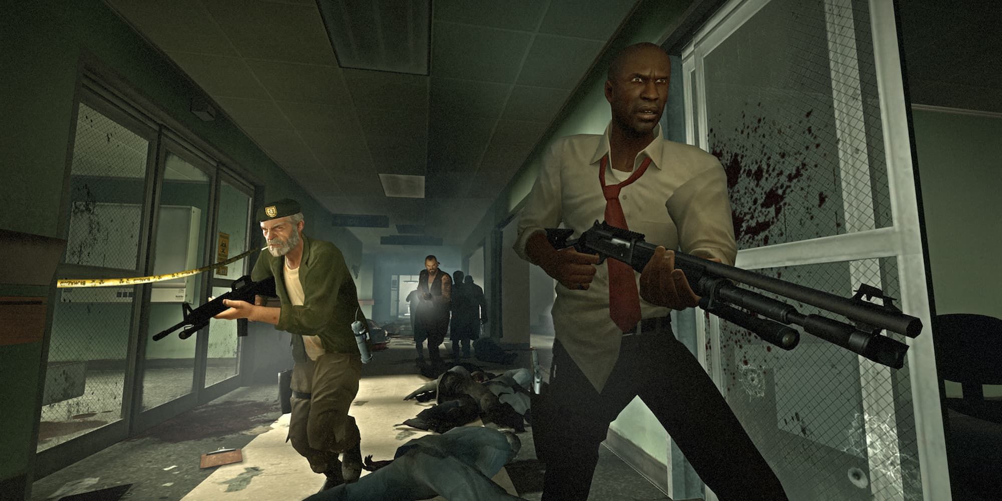 A group moves down a hallway after laying waste to a wave of zombies in Left 4 Dead.