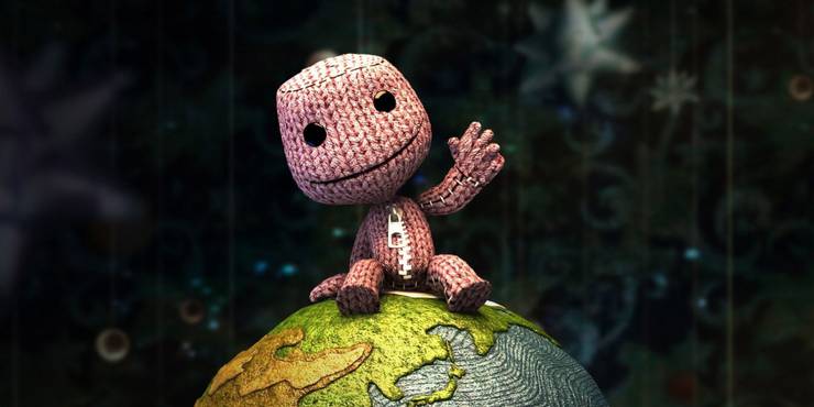 Sackboy sitting on the Earth.