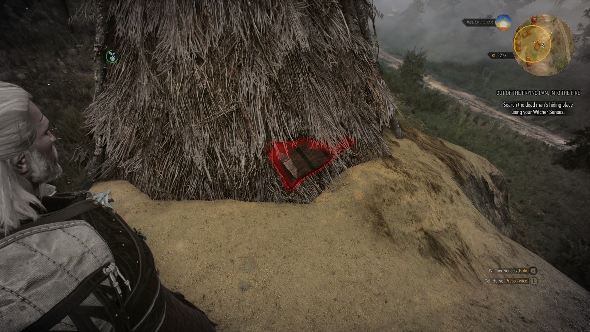 A screenshot of a treasure chest embedded in a large pile of hay and highlighted with Witcher Senses.