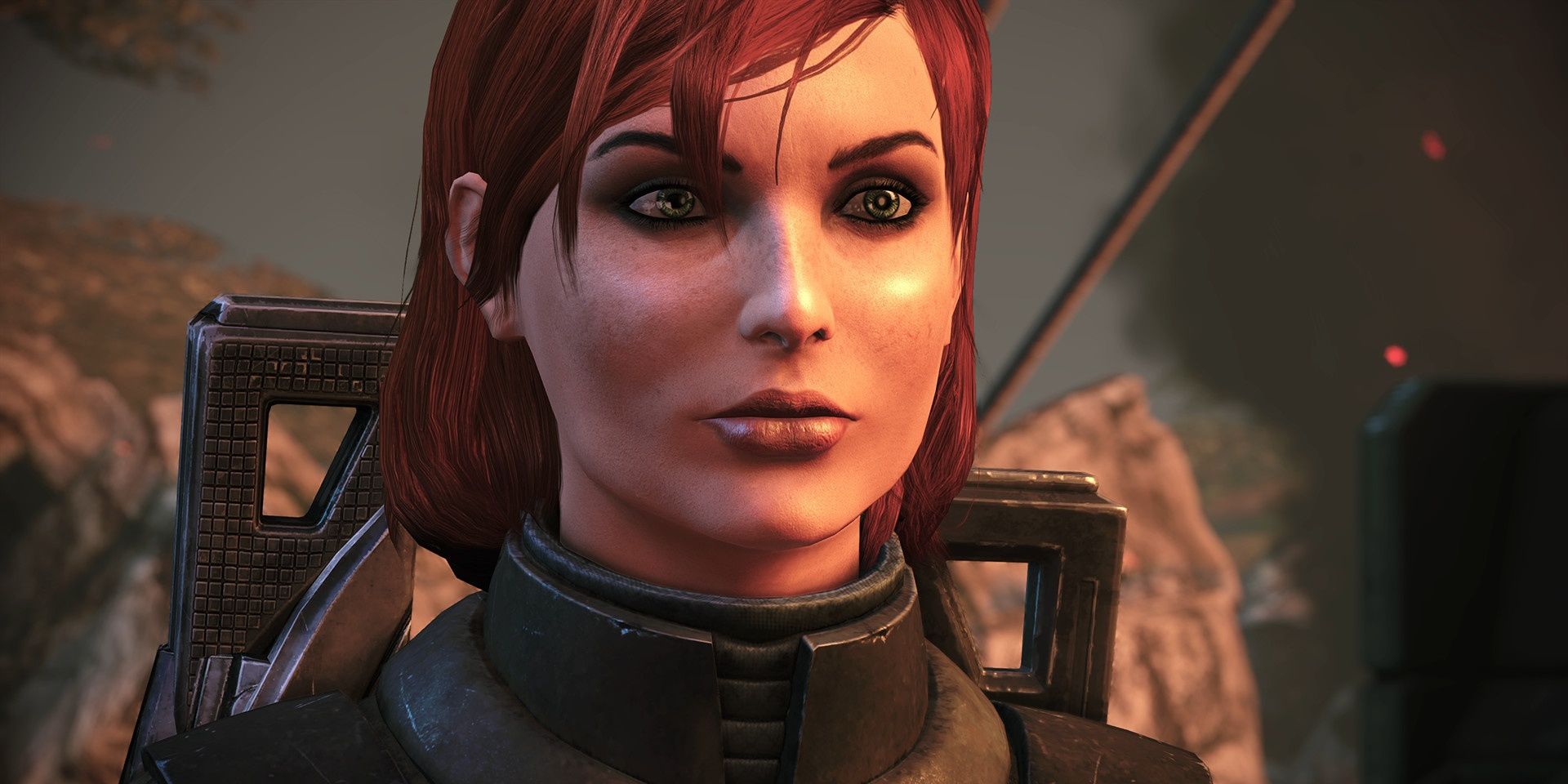 A close up of a female Commander Shepard in Mass Effect