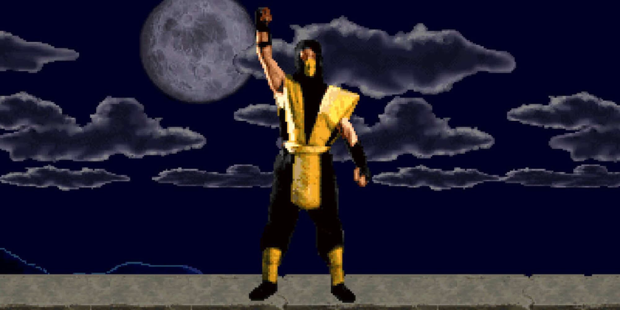 Scorpion stands on a stage with his fist in the air in the original Mortal Kombat.