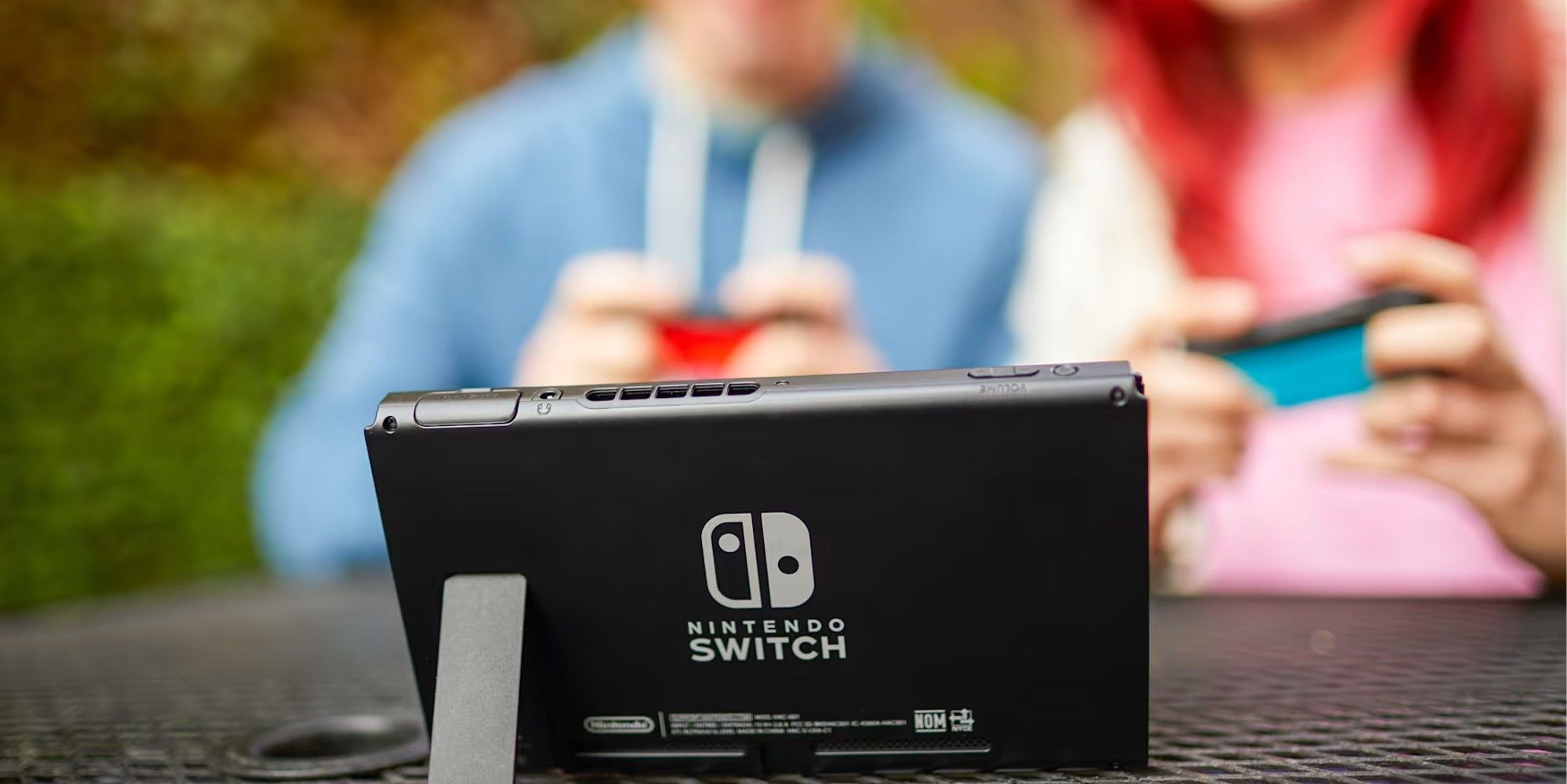 people playing a nintendo switch