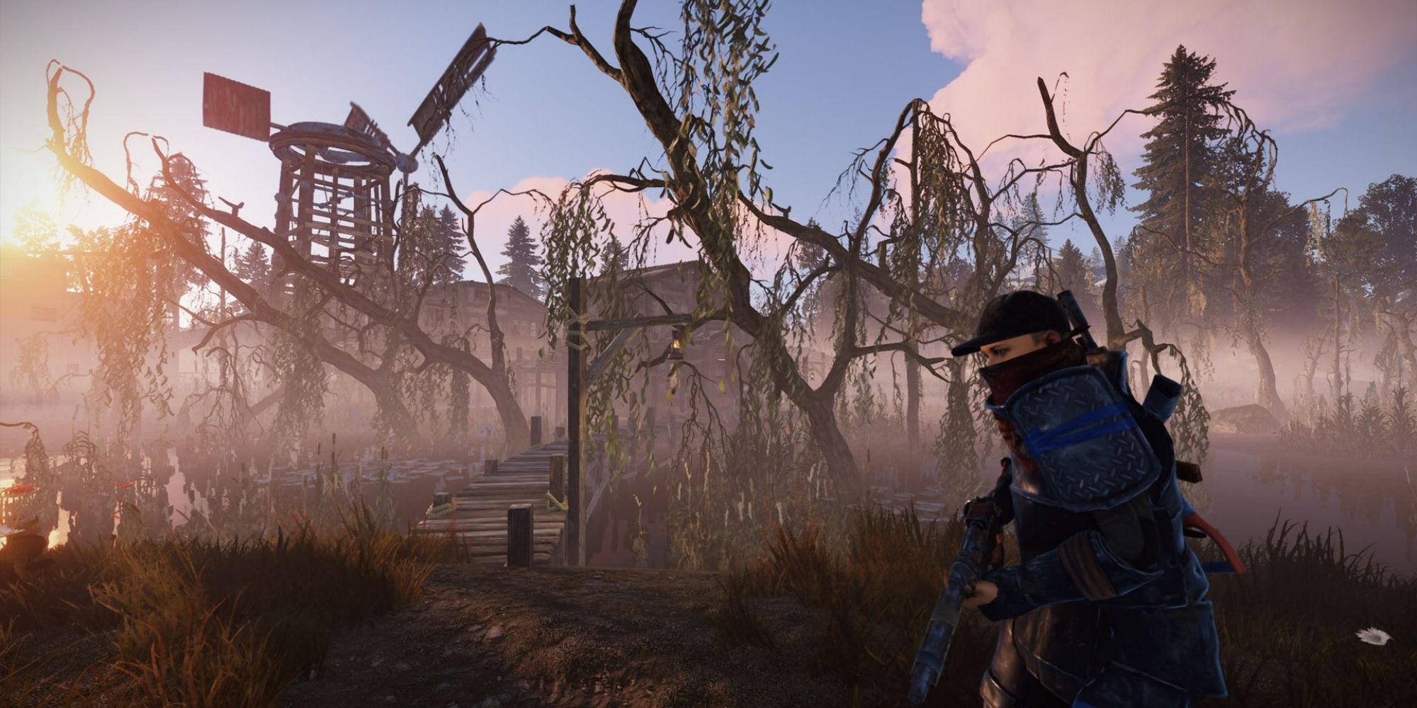 A player stands armed amidst a desolate swamp like area with a broken windmill