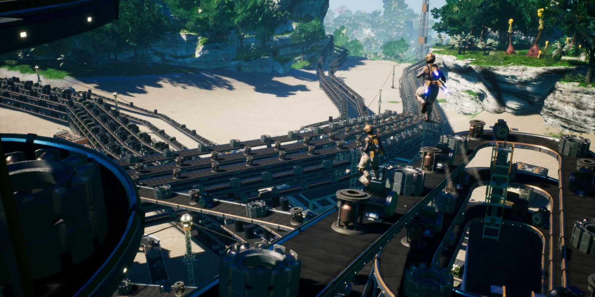Two players look over the vast amount of conveyor belts they are surrounded by
