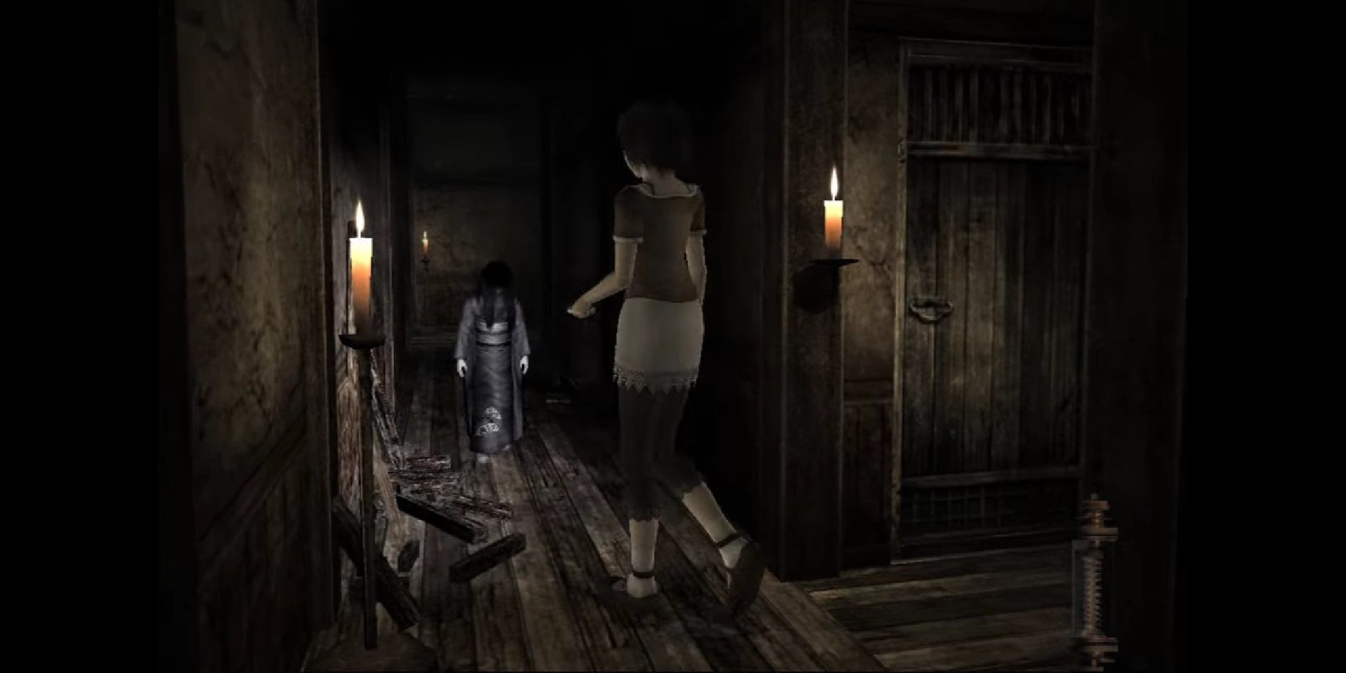 One of the twins spirits as a doll coming at the main player character in Fatal Frame 2: Crimson Butterfly.