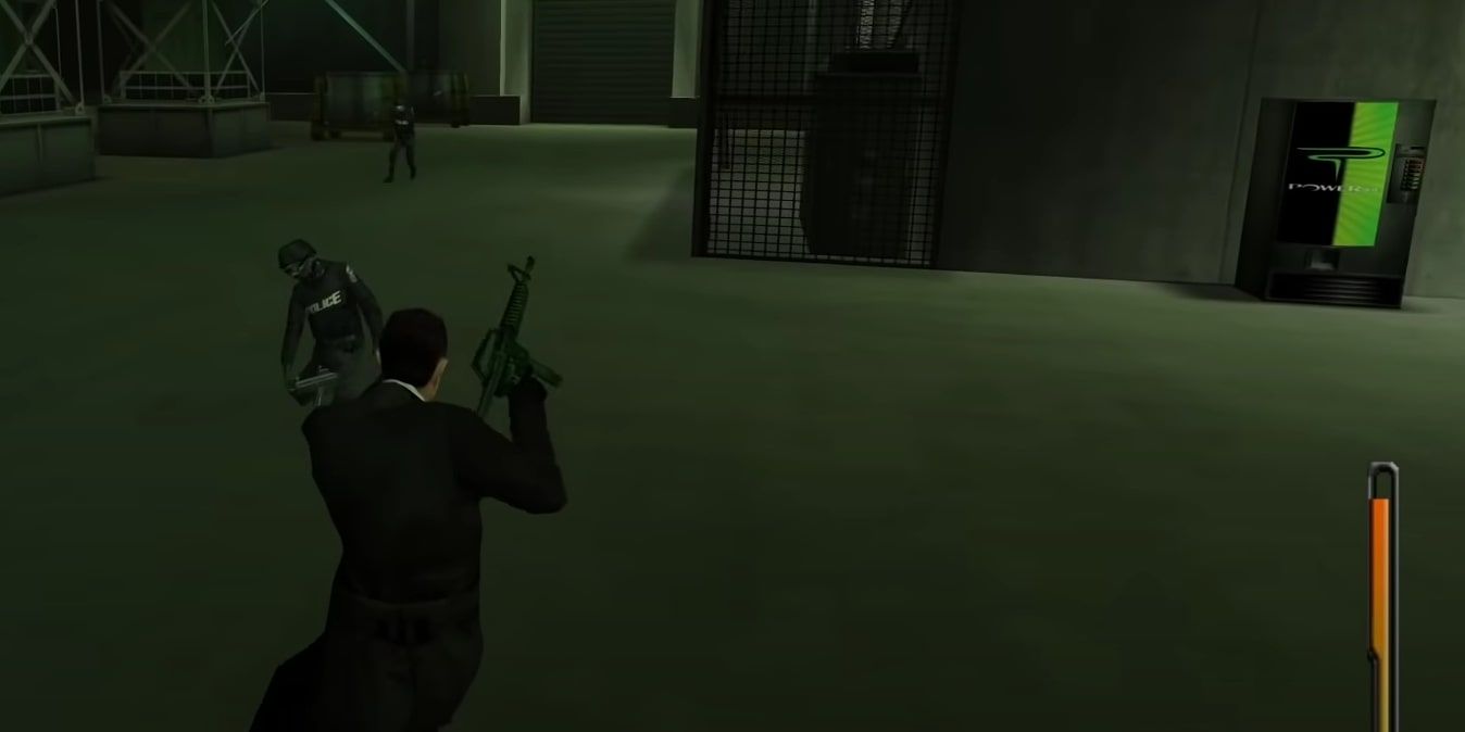 The main player character dealing with officers inside the plant, with a Powerade vending machine situated against a wall by the stairs of the facility.