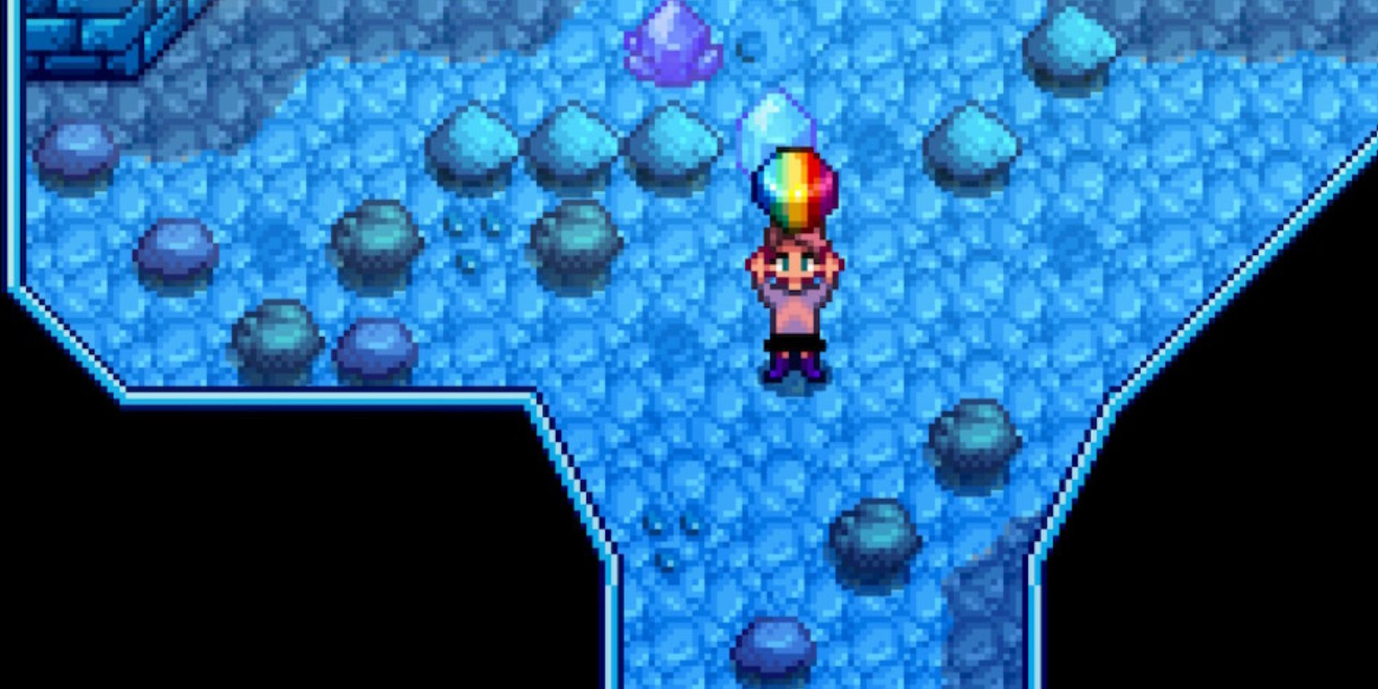 A Stardew Valley character holding a prismatic shard in the mine