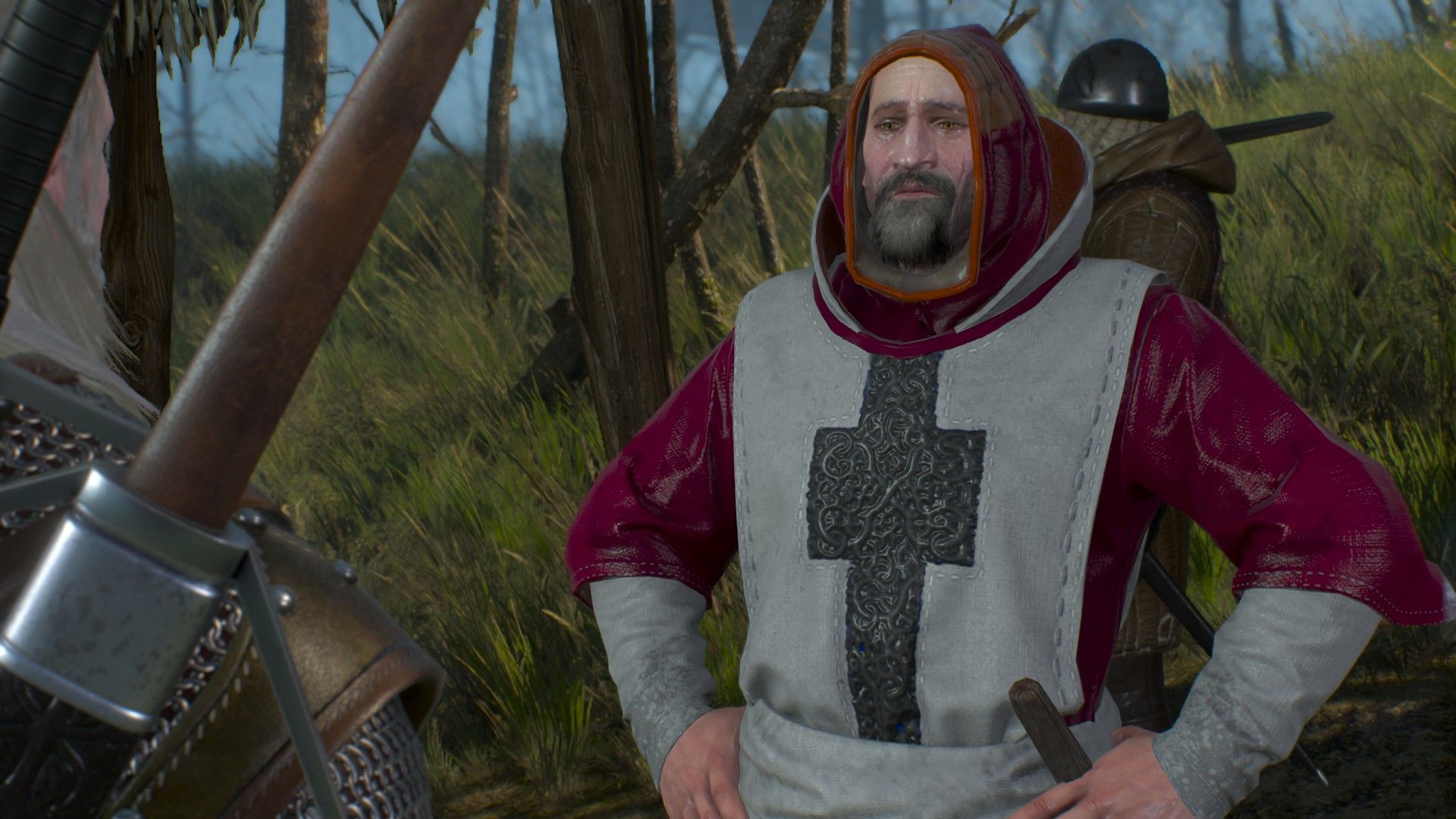 A priest of the Eternal Flame talks to Geralt in a forest.