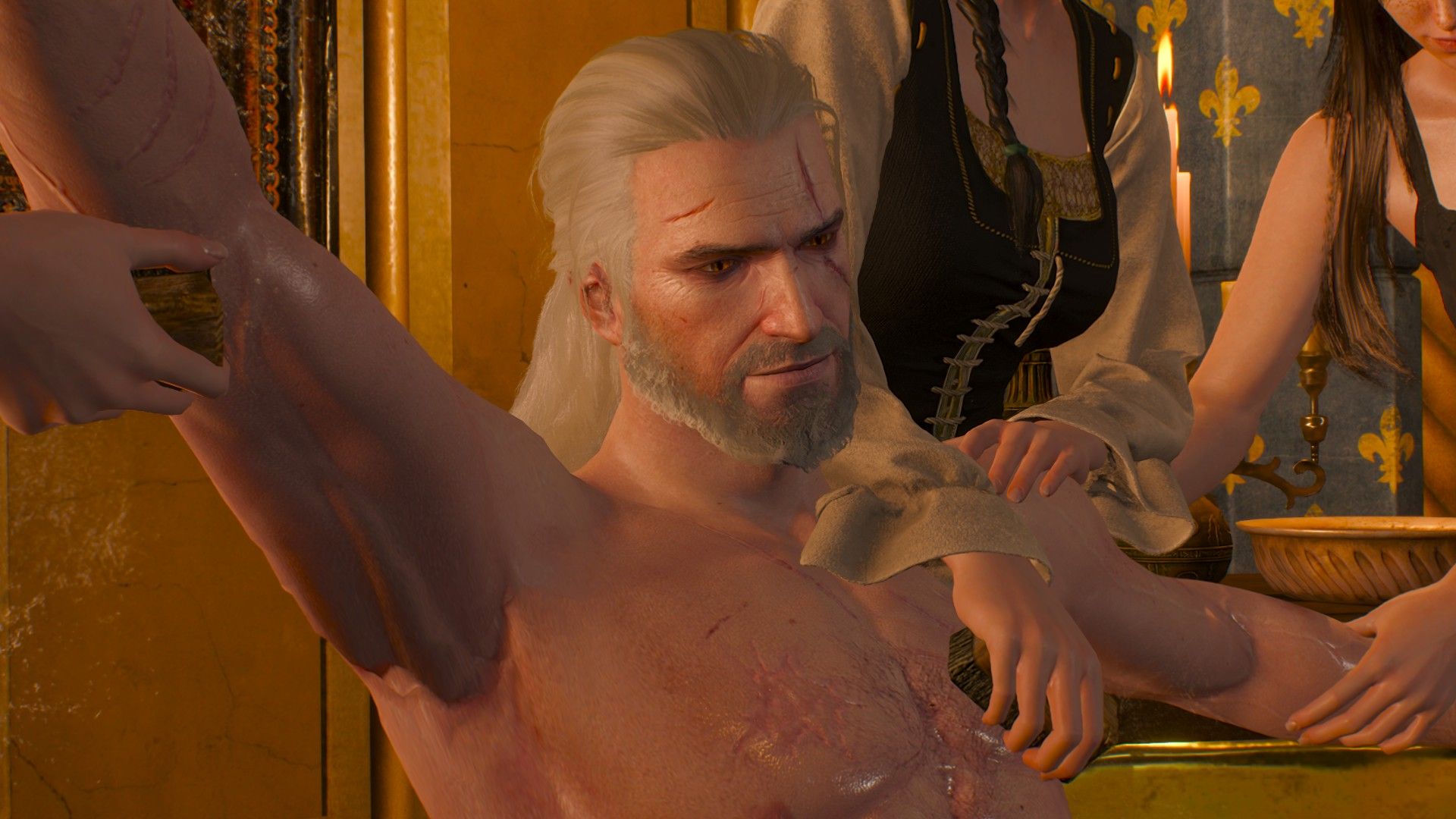 Geralt looks satisfied as three women scrub his body clean. 