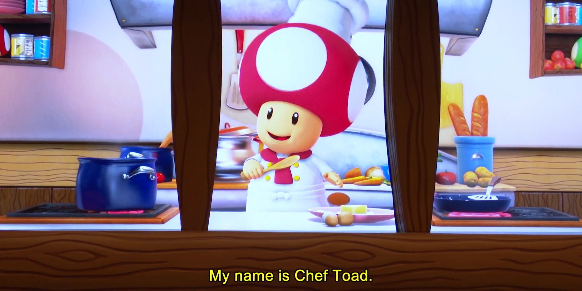 Toad, le personnage de Mario, est en tenue de chef.  Il est dans une cuisine.