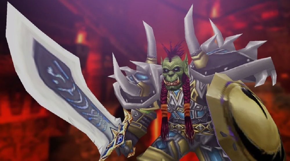 World of Warcraft: An Orc Tank is ready for battle, donned in spiked shoulder armor and holding a massive sword and shield.