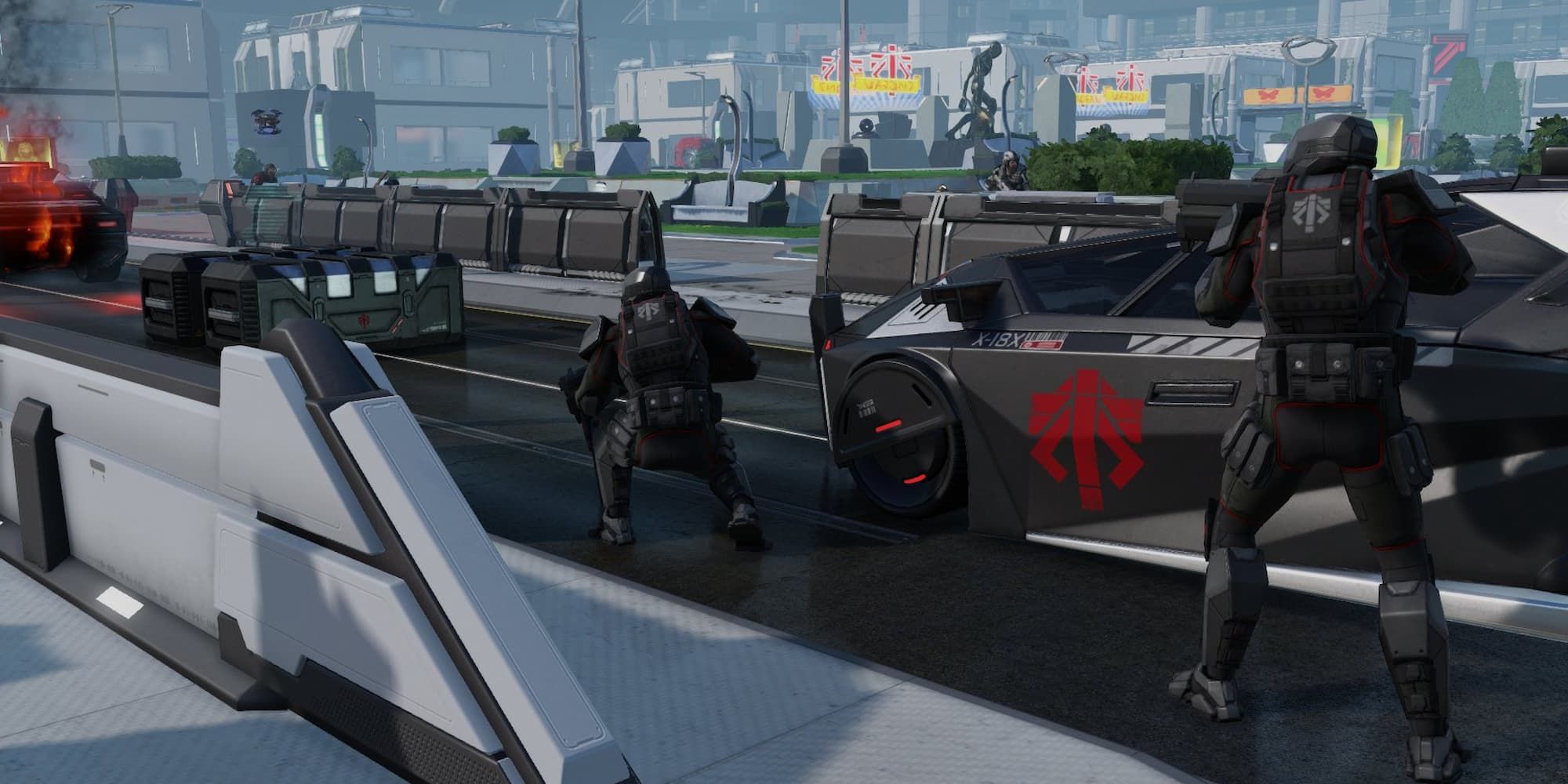Soldiers hold position on a city street in XCOM 2.