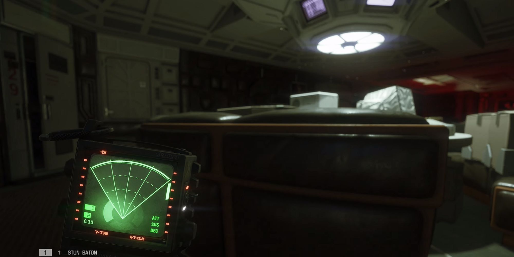 Amanda Ripley ducks behind a desk and uses her Motion Tracker to check for movement in Alien Isolation