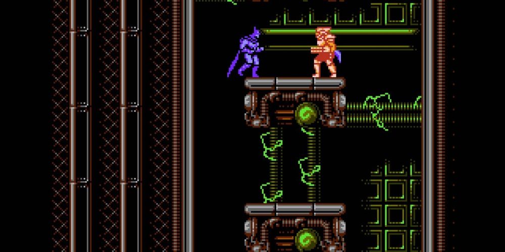 Batman facing an enemy on a platform in Batman The Video Game