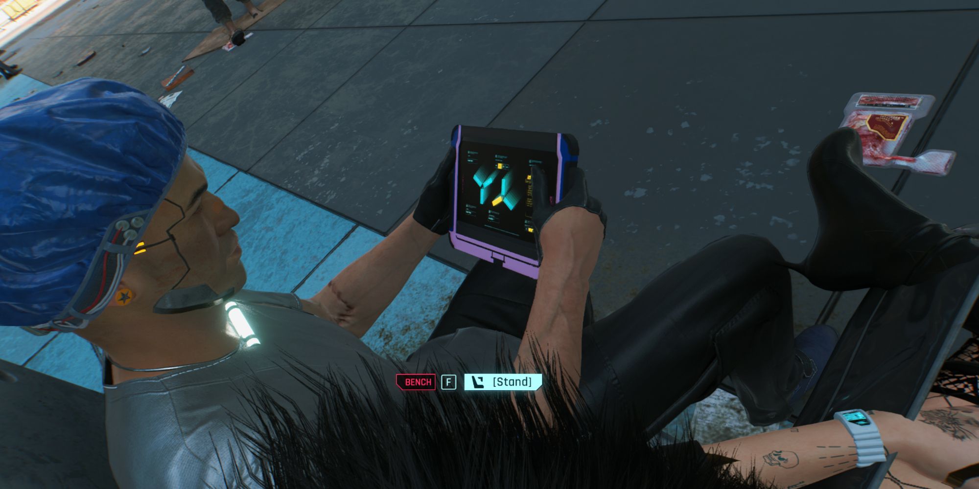cyberounk player sat down looking at a tablet